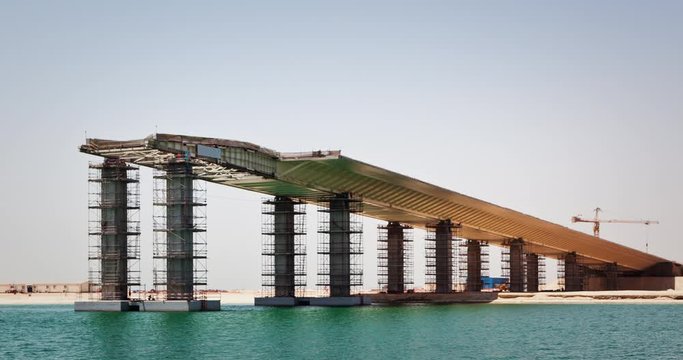 Timelapse of bridge construction with incremental launching of the deck above water