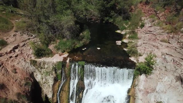 Rocky Cascading Waterfall in Arizona Desert, Aerial Drone Reveal