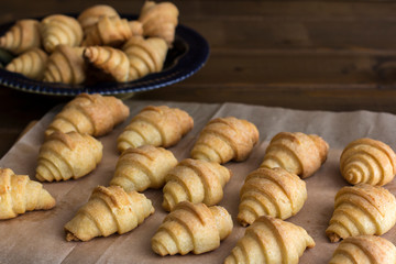 Baked bagels from cottage cheese dough lie on baking paper. Step2