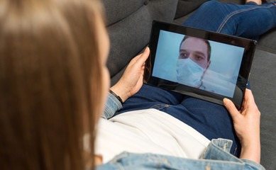 Woman communicates with man, who is in quarantine.