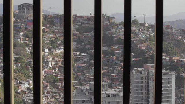 Slums of caracas behind the bars of central park building