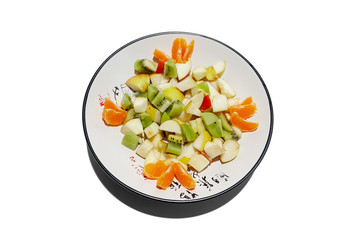 sliced fruit on a plate isolated on white background. Flat layof dish with cuted mandarin, kiwi, pear. Cut out image