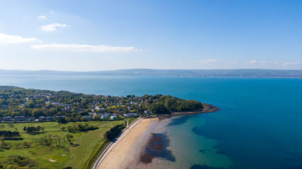 Aerial view of Coast of Irish Sea in Helen's Bay, Northern Ireland. View from above on beach in sunny day