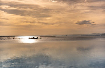 Obraz premium Sky and water, boat on the horizon, copy space