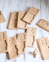 Wooden counting and writing trays - learning resource for educating littles on number writing, fine motor skills, hand eye coordination, mathematical skills. Montessori materials. Counting game