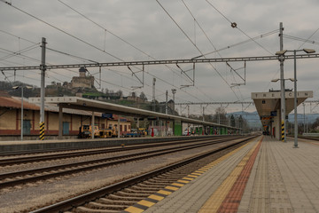 Fototapeta premium Fast passenger train with red modern electric engine in Trencin station