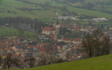 View for Brumov town and meadow in spring cloudy day in Moravia