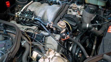 Fototapeta premium Car repair shop - engine under the car hood