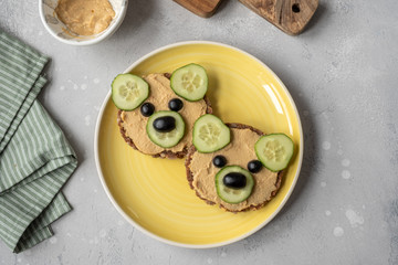 Funny bear toast with cucumber and hummus toasts