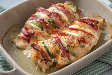 Baked hasselback chicken breast stuffed with bacon, cheese and jalapenos