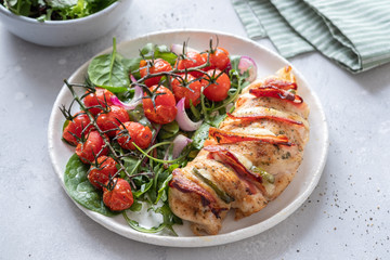 Baked hasselback chicken breast stuffed with bacon, cheese and jalapenos