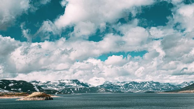 Oppland, Tyin Lake, Norway. Stones On Coast Of Beautiful Lake Tyin In Summer Day. Norwegian Nature. 4K