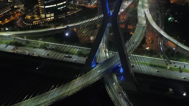 Aerial view of Estaiada bridge, at night with the buildings in background, Brazil