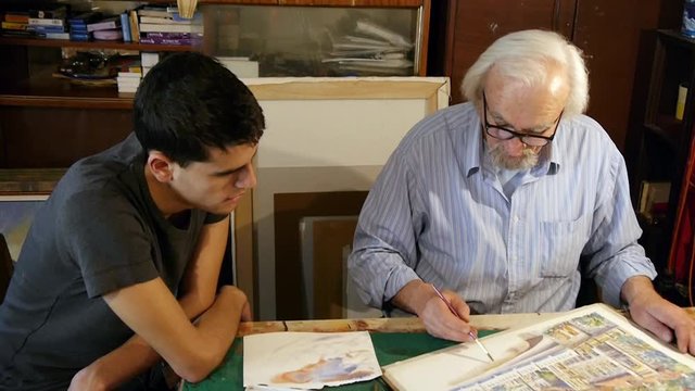 Learning to paint, an old painter shows young men how to paint watercolors, teaches him that painting technique, artistic family, father, son, grandson