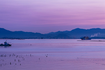 Beautiful purple dawn sunrise over Hiroshima bay, Seto Inland sea of Japan in Hiroshima, Japan