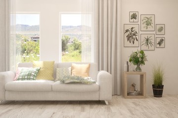 White living room with sofa and summer landscape in window. Scandinavian interior design. 3D illustration