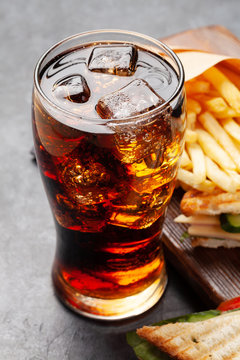Club sandwich, potato fries and cola
