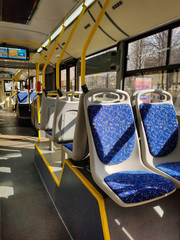 Obraz premium Empty bus. Translation of text on the screen: weather forecast for today, tuesday, morning, afternoon - cloudy, evening - cloudy