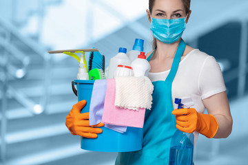 Cleaning lady with tool in cleaning in mask .