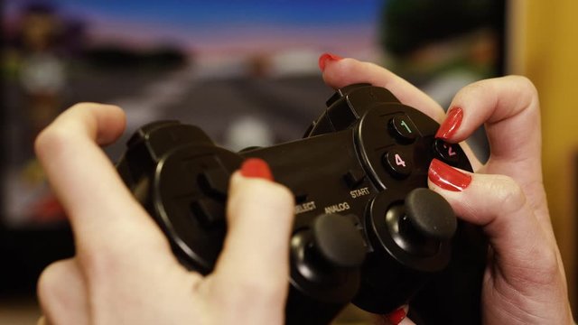 Game joystick. Girl plays joysticks in computer games.