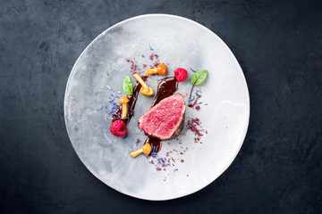 Barbecue dry aged wagyu beef fillet head medallion steak natural with forest fruits, mushrooms and...