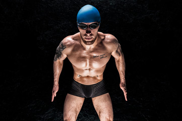 Portrait of a swimmer. The concept of swimming and sports lifestyle. Front view.
