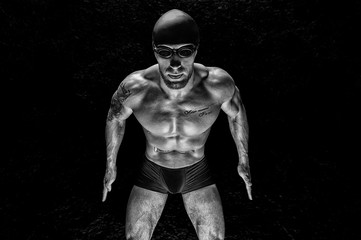 Portrait of a swimmer. The concept of swimming and sports lifestyle. Front view.