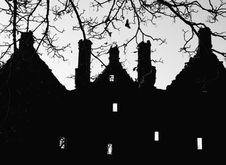 Spooky ruined Sleady Castle dark in shadow