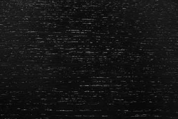 Black wood texture as background. Top view.