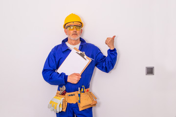 construction worker or professional man with tools and helmet