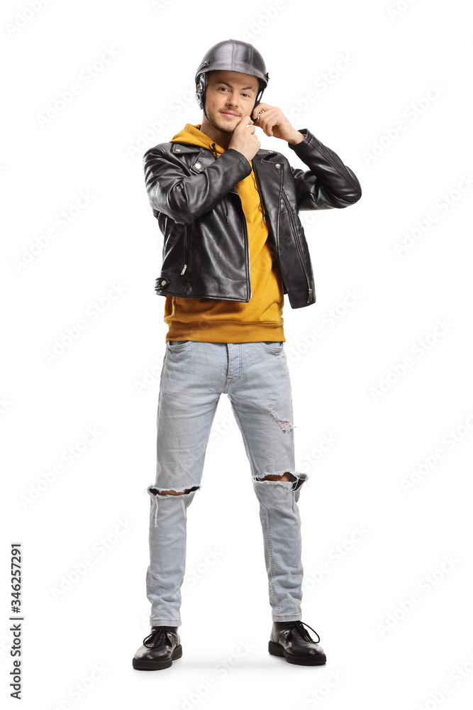 Poster young man in a leather jacket putting on a helmet