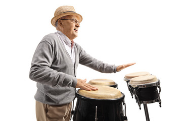 Elderly man playing conga drums