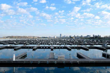 Boat Dock & Marina Empty Awaiting Boating & Shipping Season on Water, Lake, River & Ocean