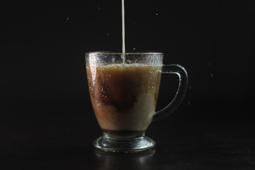The texture of coffee is mixed with milk which has a cloud-like texture