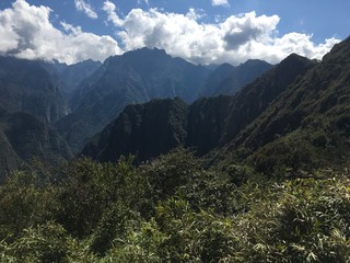 Naklejka premium Beautiful panoramic view of famous mountains machu picchu peru, south america. Inca city, peruvian civilization. Green Landscape, panorama of andes
