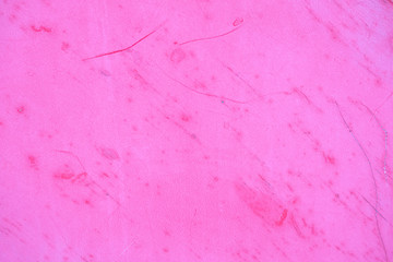 the texture of the wooden walls painted in pink color. Background with scratches