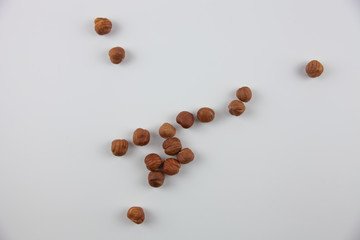 Hazelnuts on a white background. Healthy lifestyle. Ingredients for baking.