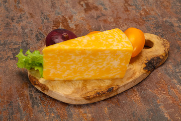 Marble cheese  triangle over wooden
