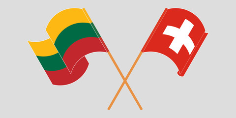 Crossed and waving flags of Switzerland and Lithuania