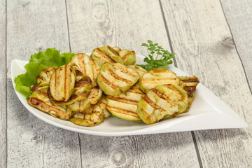 Grilled eggplant slices served basil