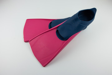 Pink fins for snorkeling on a white background. Equipment for outdoor activities