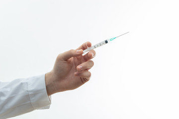 Doctor hand injecting medicine with syringe isolated against white background, closeup