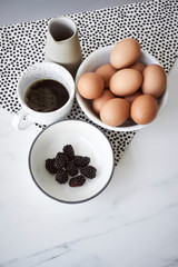 Eggs, black coffee and black berries © 4Media Creations