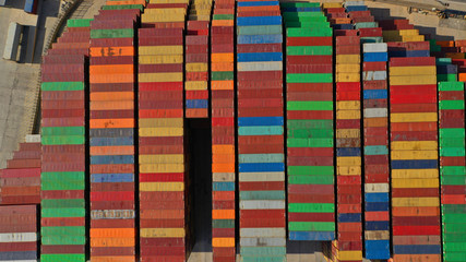 Aerial drone top down photo of colourful containers parked in Mediterranean container terminal