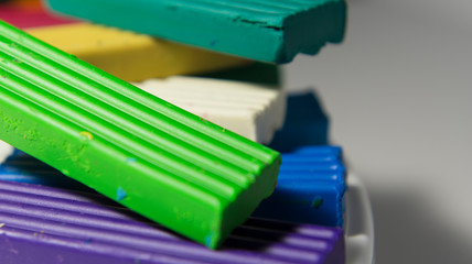 Colorful children’s plasticine. All the colors of the rainbow. Mass for the foot