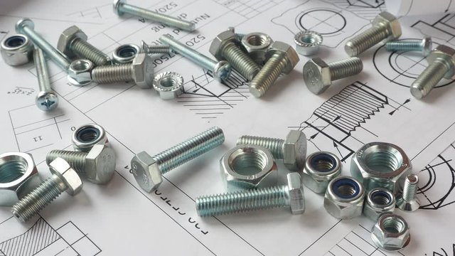 Bolts and nuts on paper engineering drawings