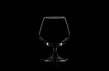 empty glass on black background, copy space