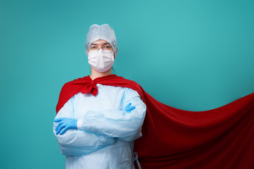 Doctor wearing surgical face mask in superhero cape.