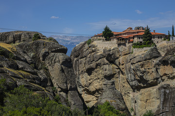 Fototapeta na wymiar Monastery, located on rocky abyss top at height of more than 400 meters. Meteora is one of largest, most important complexes of Eastern Orthodox monasteries in Greece. Meteora, Peneas Valley, Greece.