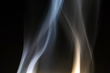 floating, defocused smoke on a black background
